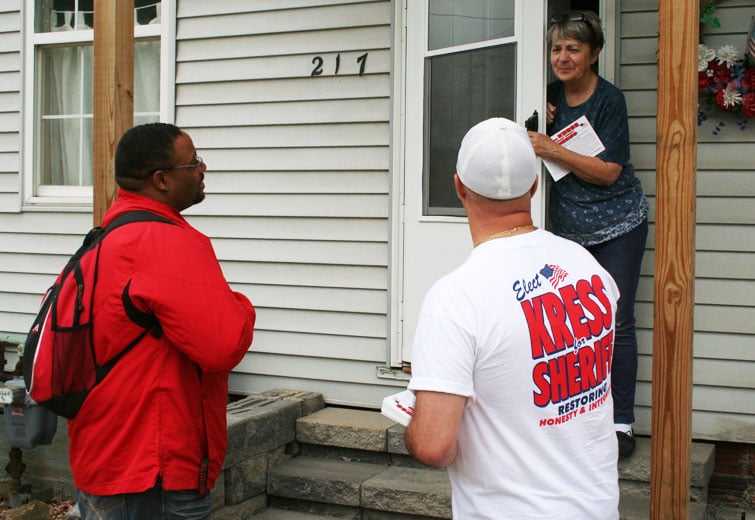 Aliquippa Mayor Dwan Walker (left) with Democratic Sheriff Candidate Wayne Kress canvasing homes in West Aliquippa. Kress, a retired State Trooper from Center Township, is hoping to unseat incumbent Sheriff George David. / photo by John Paul