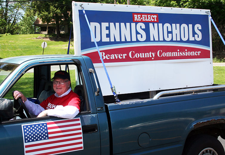 Incumbent Republican Commissioner Dennis Nichols campaigning in Brighton Township. Nichols lost his bid for reelection in the primary to Dan Camp and Sandie Egley / photo by John Paul